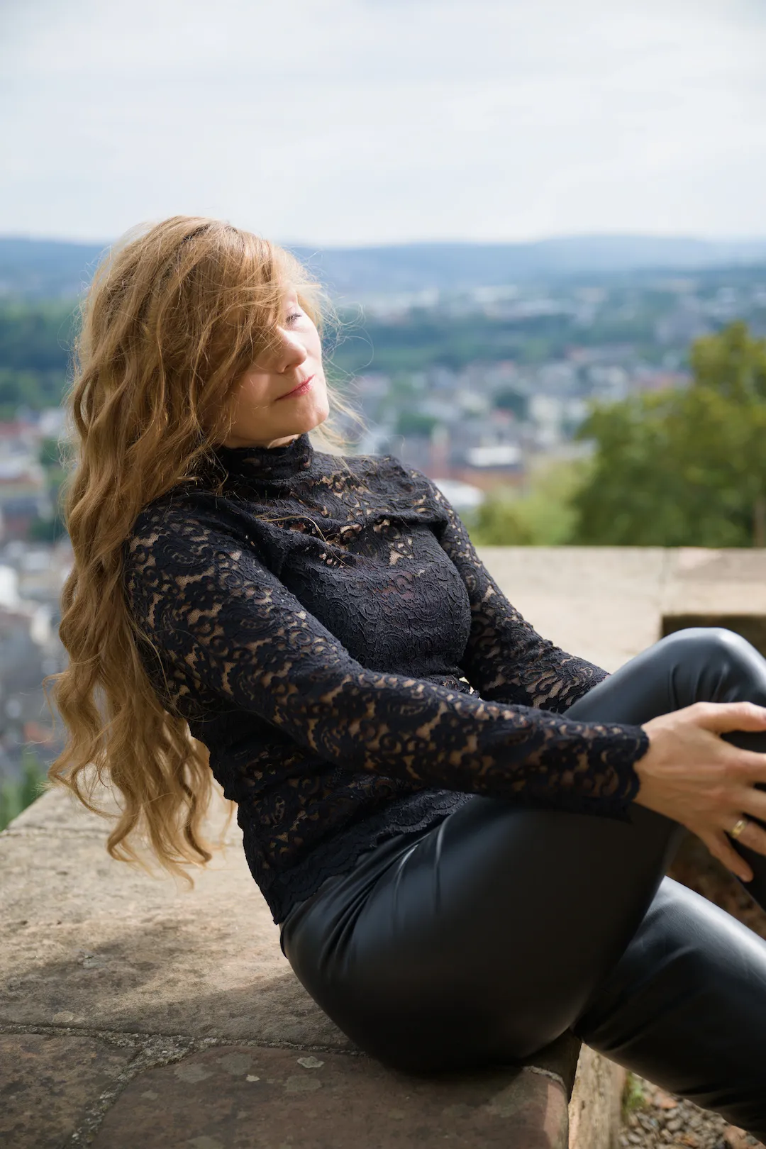 Luxury fashion portrait with sculptural hair styling at Marburg Castle