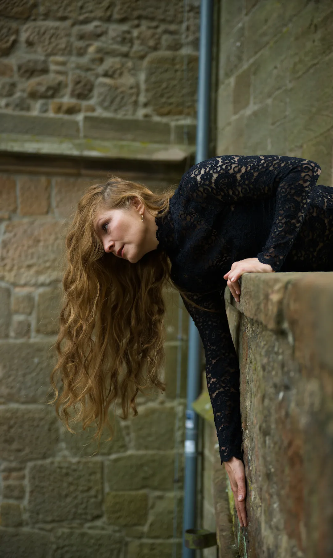 Bold fashion portrait with statement hair at Marburg Castle