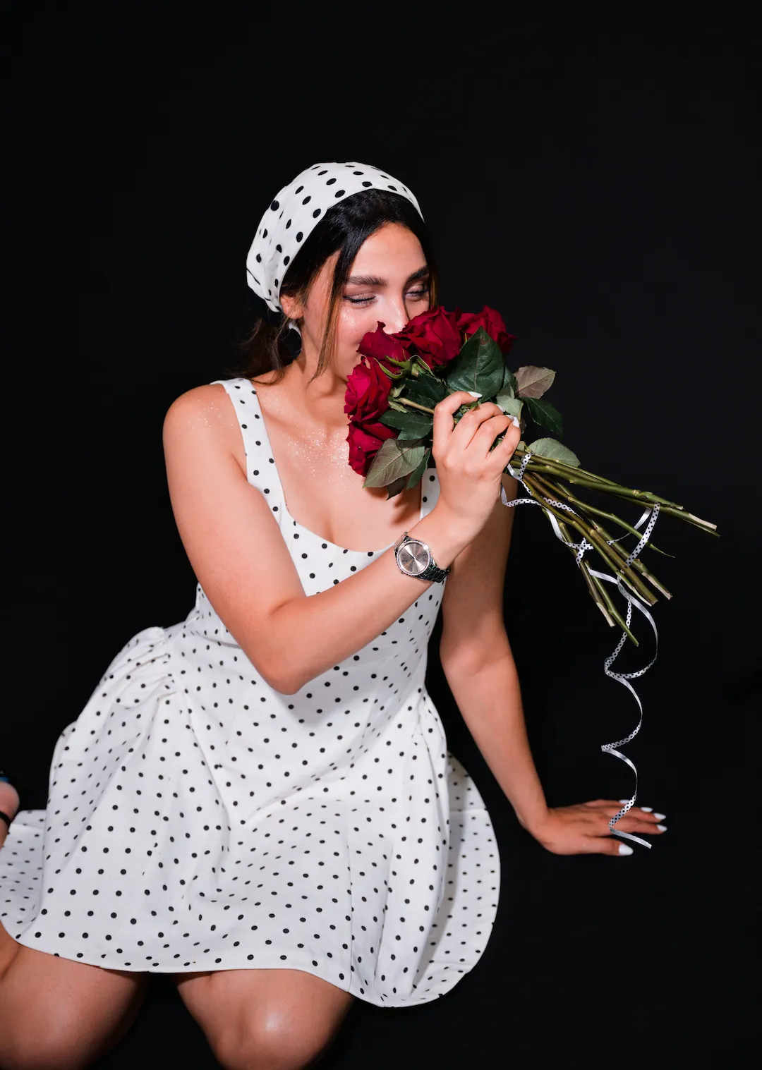Studio portrait photography with off-camera flash sitting on the floor